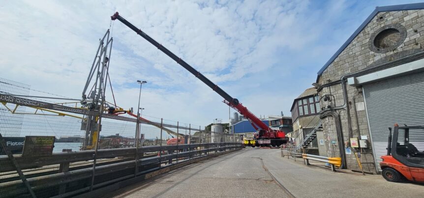 Sparrow crane lift Flotech fuel arm installation
