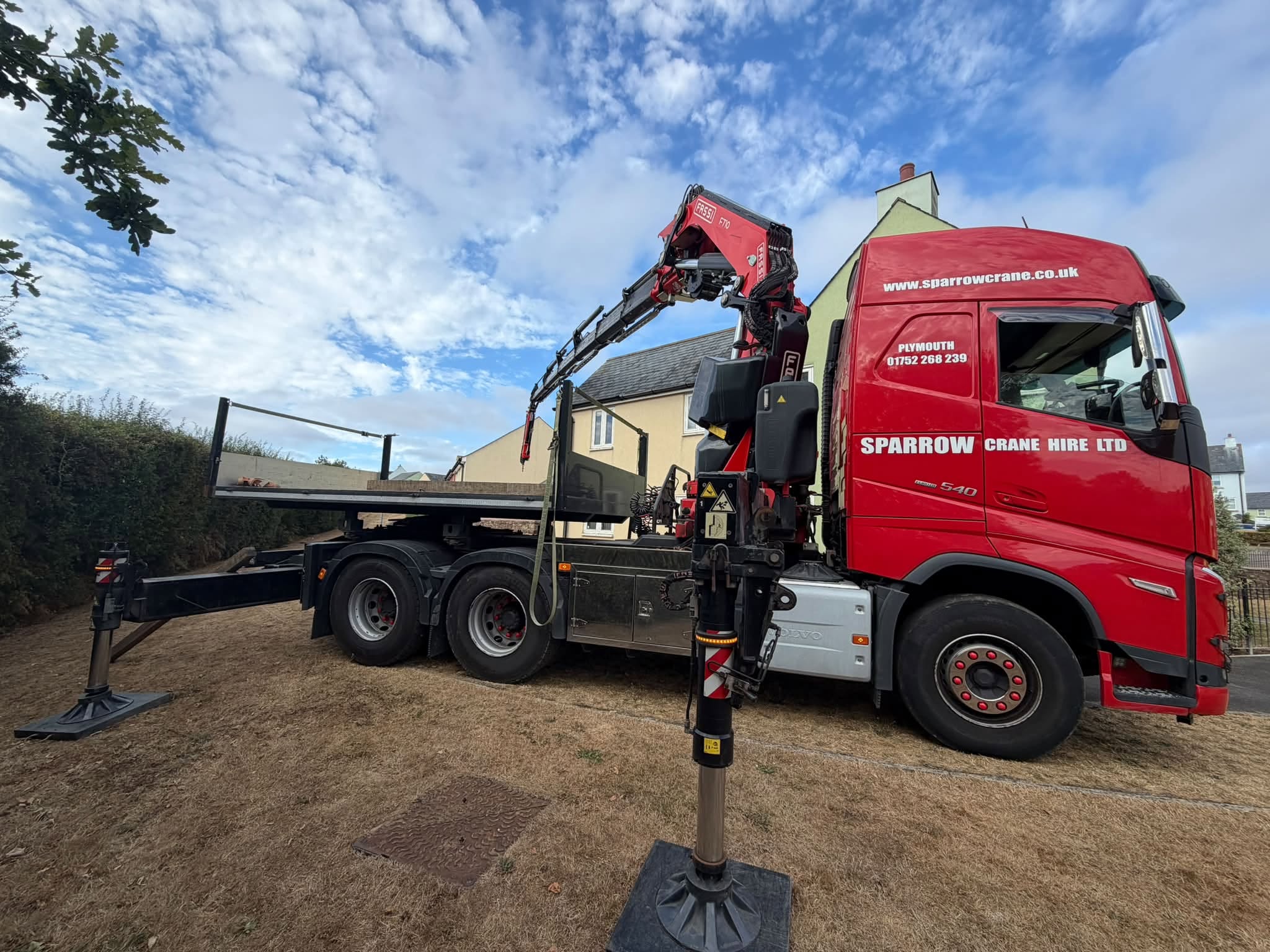 Lorry mounted Fassi Hiab crane set up for lifting in Plymouth