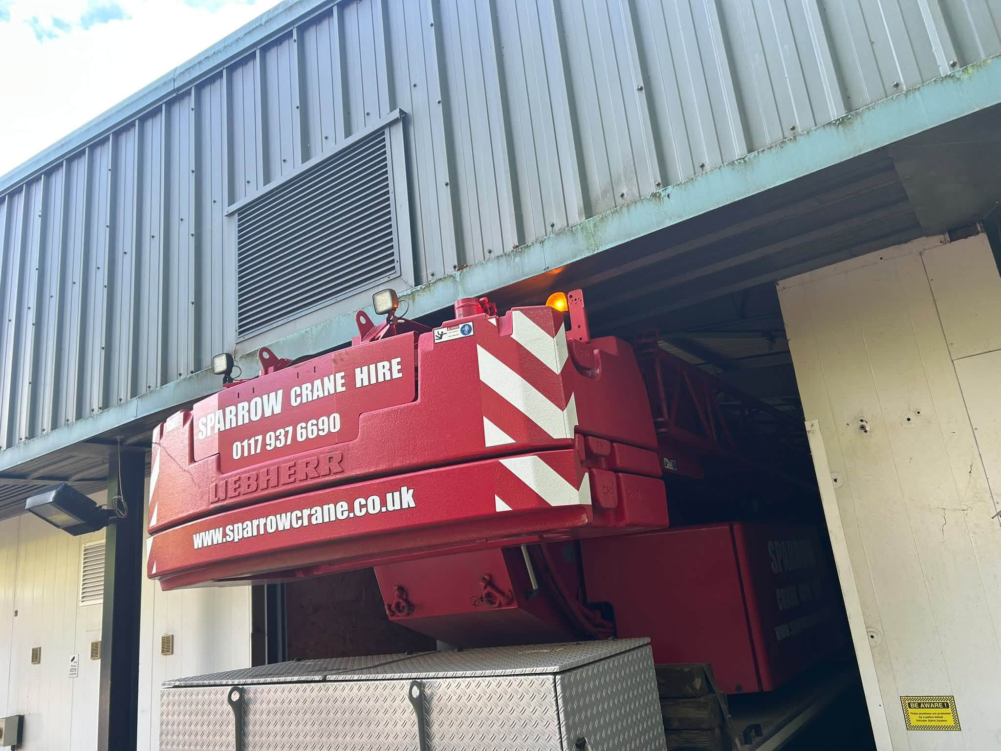 Liebherr 60-tonne mobile crane inside industrial building Rogerstone Newport